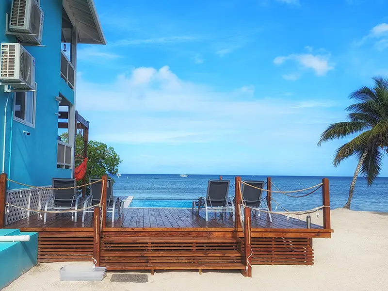 Pool Deck With Lounge Chairs On The Beach