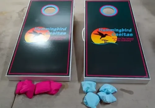 Enjoy A Game Of Cornhole On The Beach.